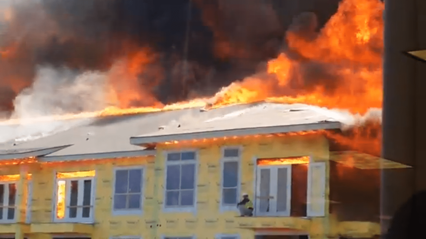 OMG! Man on top of burning complex Fire – WATCH NOW!
