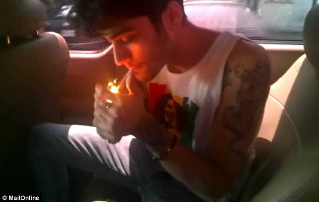 One Direction members caught smoking marijuana